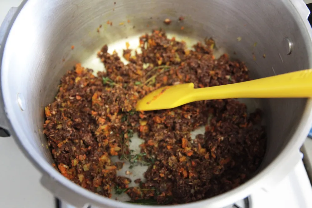 Sauteing the solid ingredients.